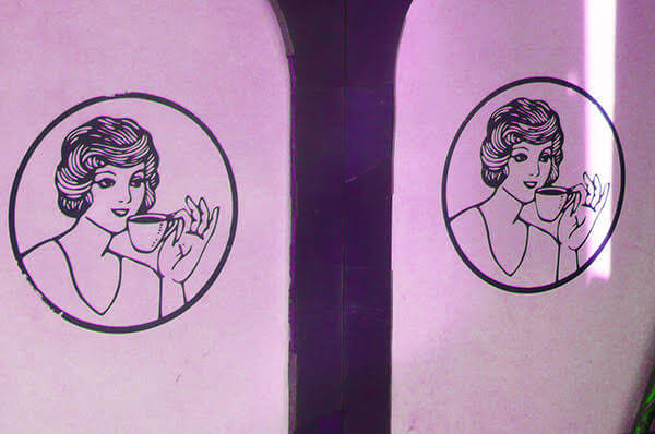 logo drawings of a woman drinking a cup of coffee