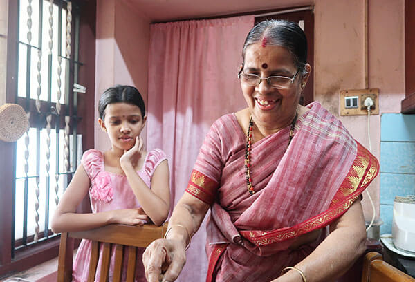 smiling indian woman and child